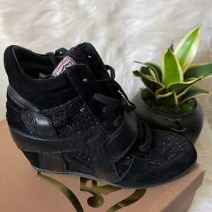 Black wedges embellished with tiny dark blue stones.